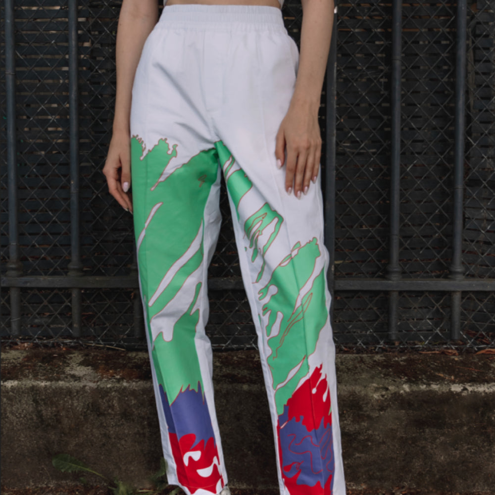 Close-up of the colorful patterned trousers on an individual.